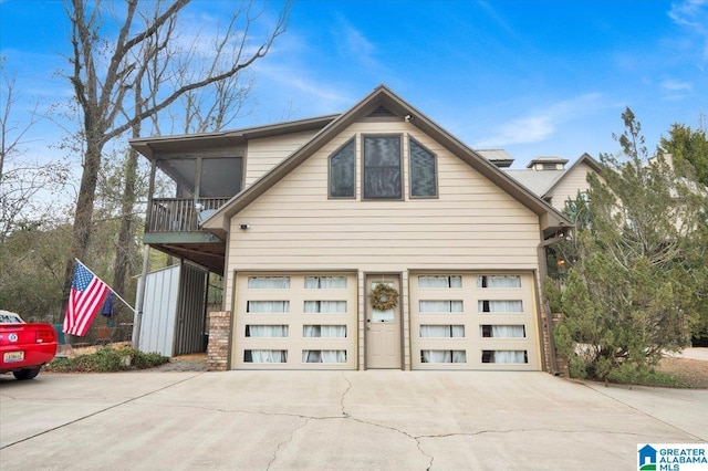 view of front of house with a garage and a balcony