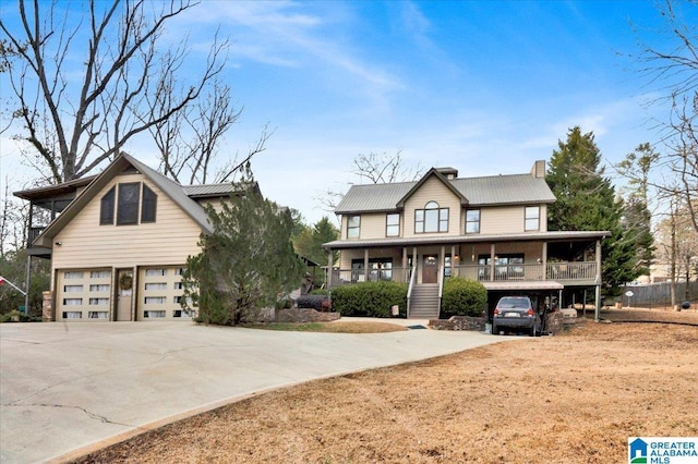 view of front of house with a porch and a garage