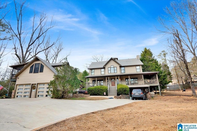 view of front of home with a garage and covered porch