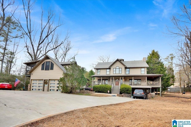 view of front facade with a garage and covered porch