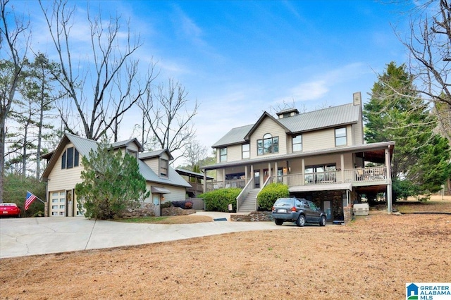 view of front of home with a garage and covered porch