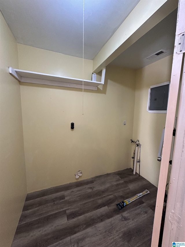 laundry room featuring washer hookup, dark wood-type flooring, and electric panel