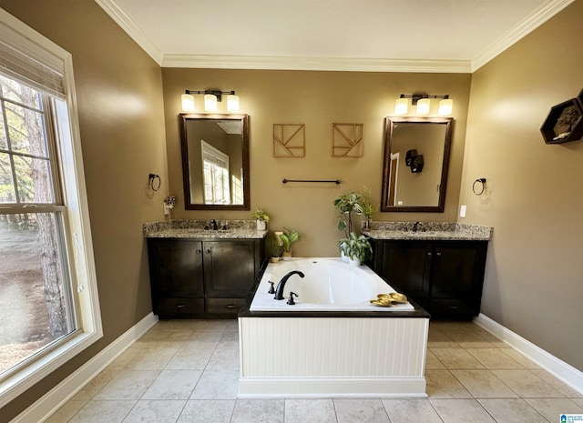 bathroom featuring ornamental molding, tile patterned floors, a washtub, and vanity