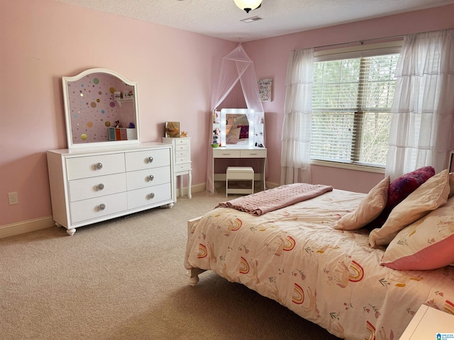 carpeted bedroom with a textured ceiling and ceiling fan