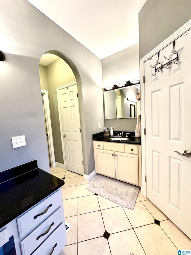 bathroom featuring vanity and tile patterned flooring