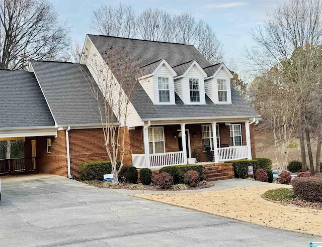 new england style home with a porch