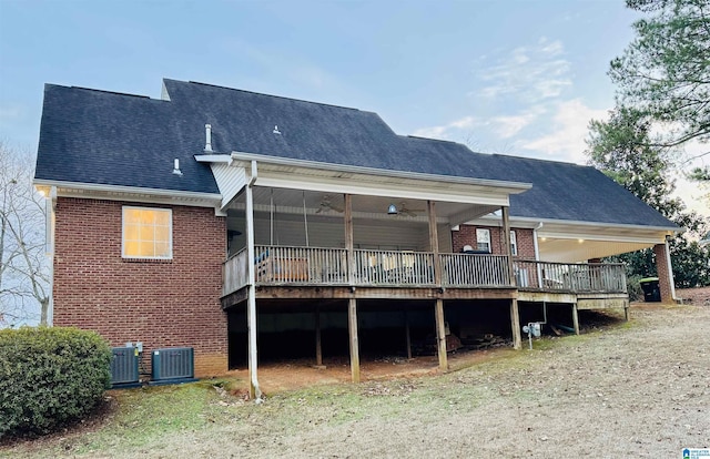 back of property featuring central air condition unit and a deck