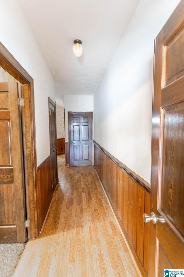 hallway with light hardwood / wood-style flooring