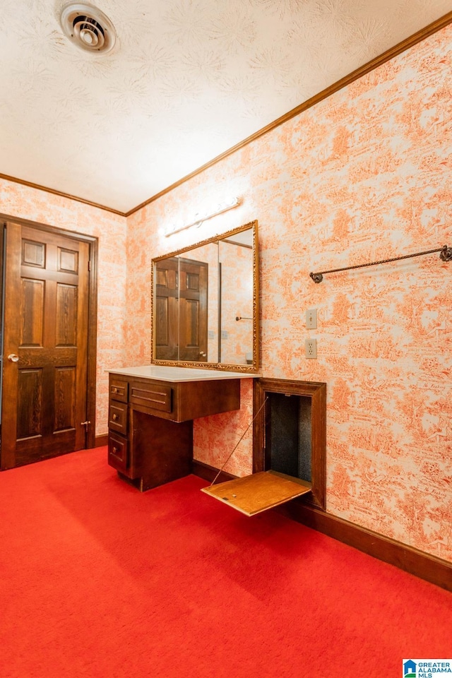 bathroom featuring a textured ceiling and ornamental molding