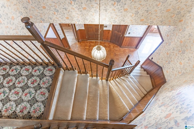 stairs featuring parquet floors