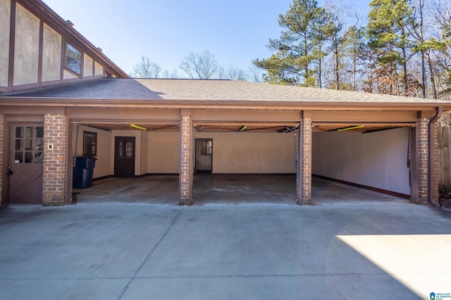 garage featuring a carport