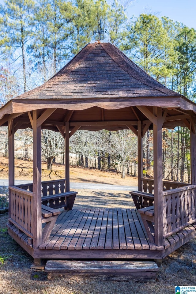 wooden deck featuring a gazebo