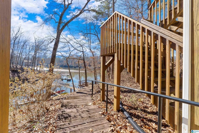 wooden deck featuring a water view