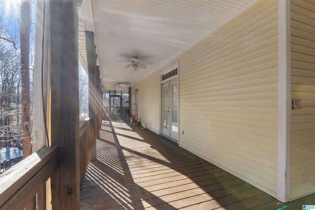 wooden terrace featuring ceiling fan