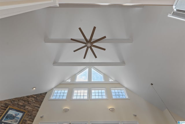 interior details with ceiling fan and beamed ceiling