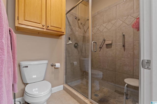 bathroom with toilet, an enclosed shower, and tile patterned floors