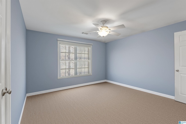 carpeted empty room featuring ceiling fan