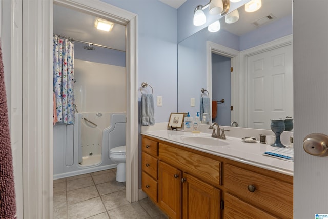 bathroom featuring tile patterned floors, walk in shower, toilet, and vanity