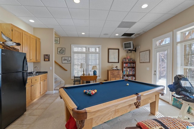 recreation room with billiards, a paneled ceiling, sink, and light tile patterned floors