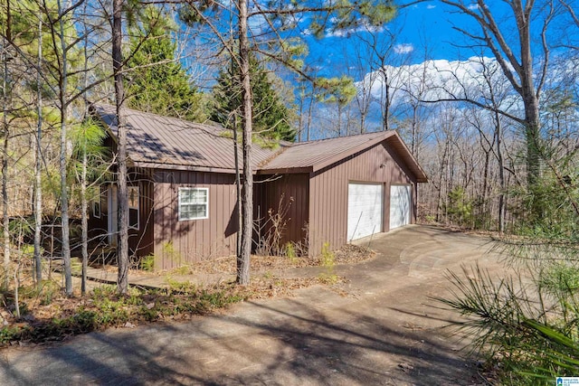 view of side of property with a garage