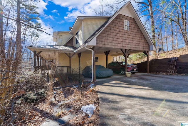 view of side of property featuring a carport