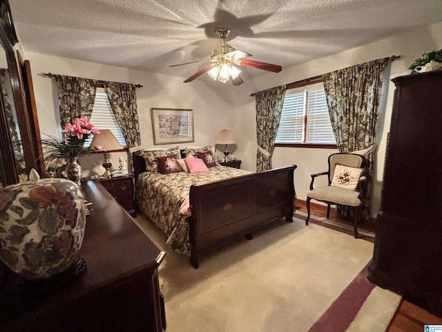 bedroom with a textured ceiling and ceiling fan