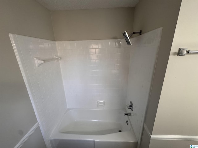 bathroom with bathing tub / shower combination