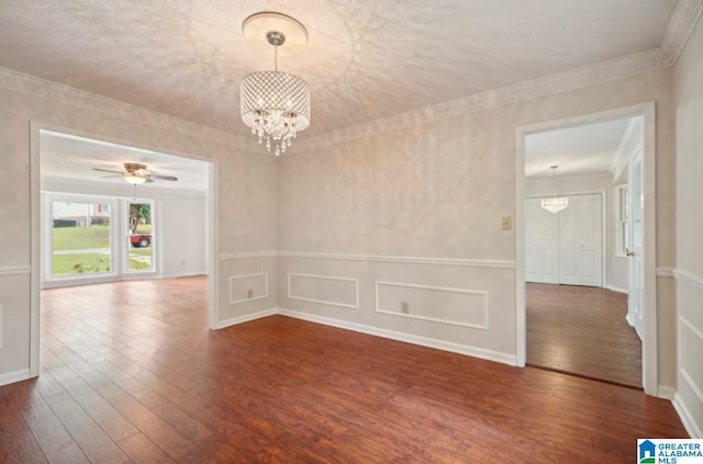 unfurnished room with ceiling fan with notable chandelier and hardwood / wood-style flooring