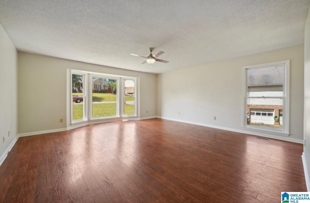 unfurnished room featuring hardwood / wood-style flooring, a textured ceiling, and ceiling fan