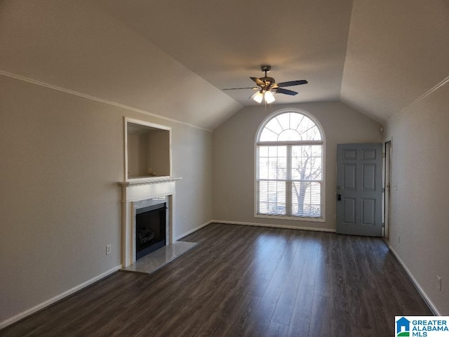 unfurnished living room featuring ceiling fan, dark hardwood / wood-style flooring, and lofted ceiling