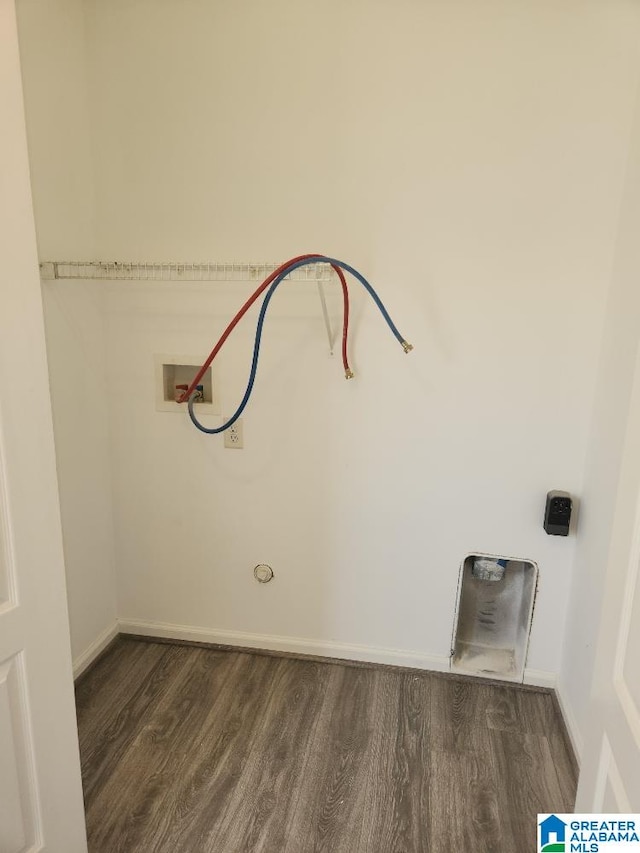 interior space featuring washer hookup and dark hardwood / wood-style flooring