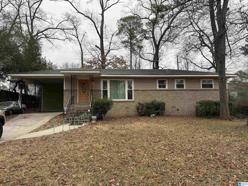 view of front of home with a carport