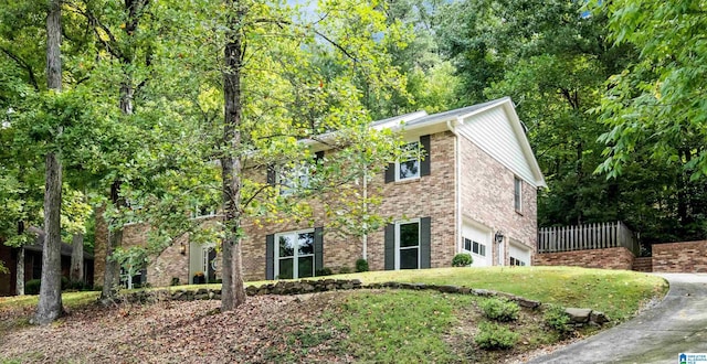 view of side of home featuring a garage