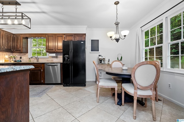 kitchen with dishwasher, a notable chandelier, pendant lighting, black refrigerator with ice dispenser, and light stone counters