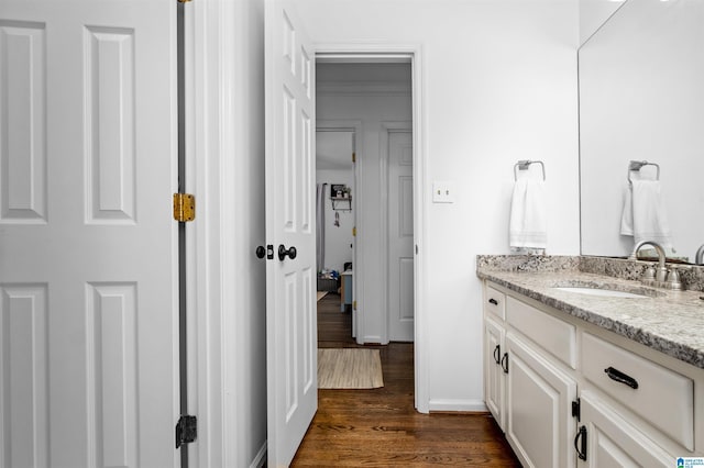 bathroom featuring wood-type flooring and vanity