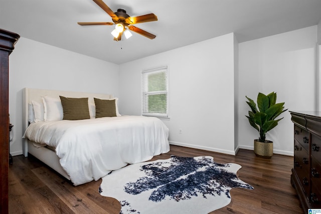 bedroom featuring ceiling fan and dark hardwood / wood-style flooring