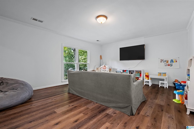 living room with dark wood-type flooring and ornamental molding