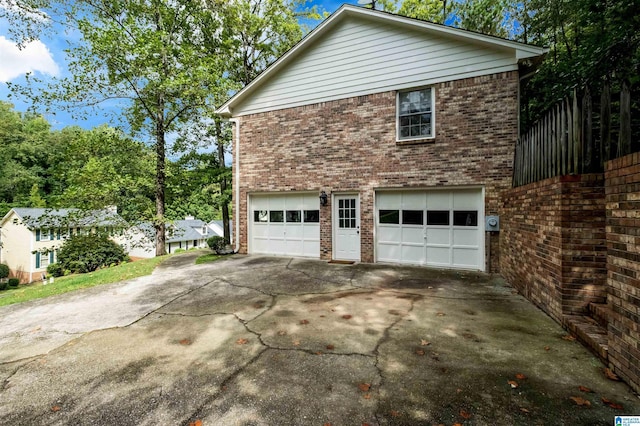 view of side of property featuring a garage