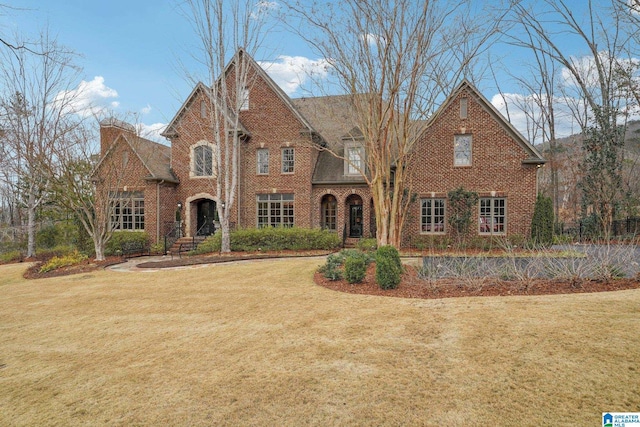 tudor house with a front yard