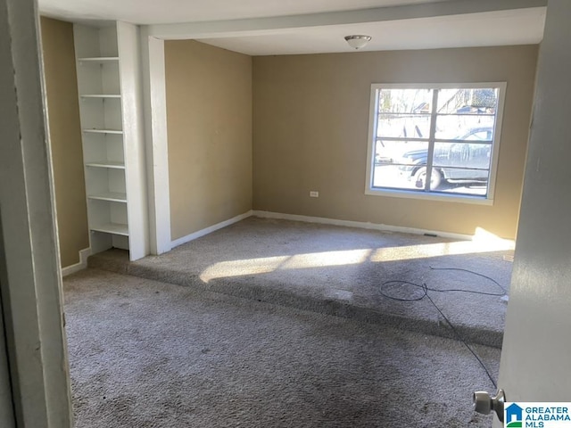 unfurnished room featuring carpet flooring