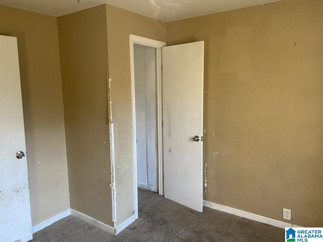 unfurnished bedroom with light colored carpet