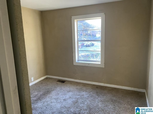 empty room with carpet flooring