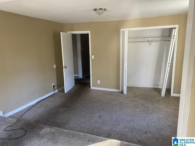 unfurnished bedroom featuring a closet and carpet