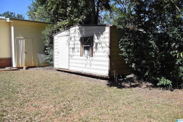 view of outdoor structure with a lawn