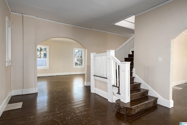 stairs with hardwood / wood-style floors