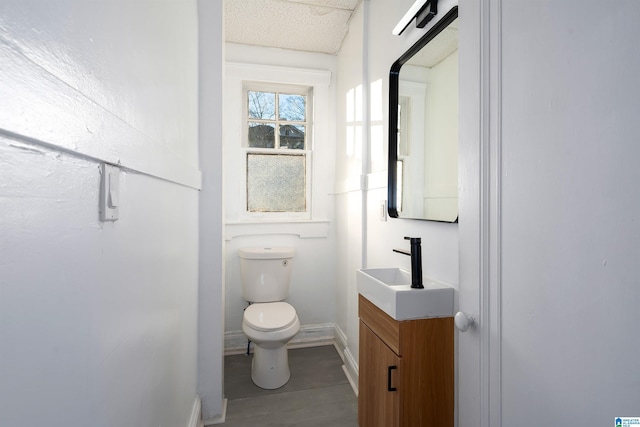 bathroom featuring toilet and vanity