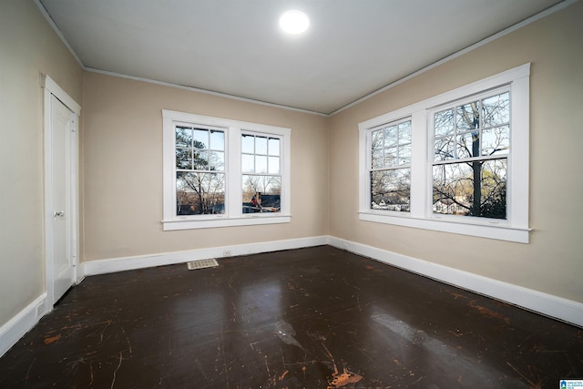 unfurnished room featuring ornamental molding