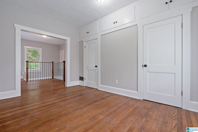 spare room featuring hardwood / wood-style flooring