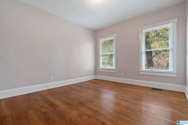 empty room featuring hardwood / wood-style flooring