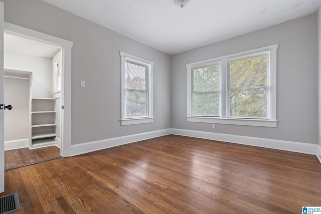 empty room with wood-type flooring